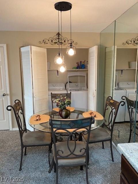 dining room with washing machine and dryer and carpet