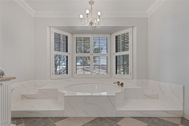 bathroom with vanity, crown molding, a notable chandelier, and a tub