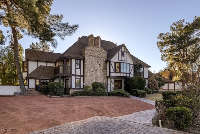 english style home with a balcony