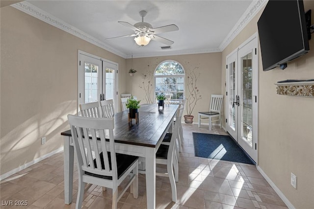 dining area with ceiling fan, french doors, crown molding, and light tile patterned floors