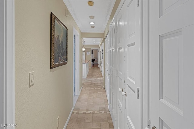 corridor featuring crown molding