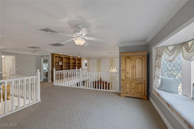 unfurnished room featuring ornamental molding, ceiling fan, and light colored carpet