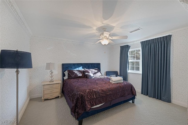 bedroom with ceiling fan, ornamental molding, and light colored carpet