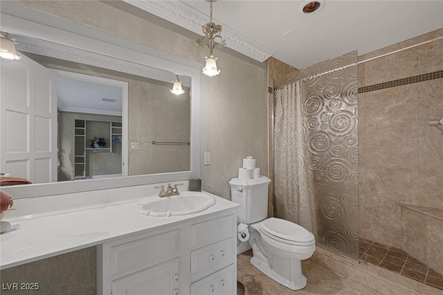 bathroom featuring toilet, vanity, ornamental molding, and walk in shower