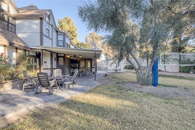 view of yard with a patio and ceiling fan