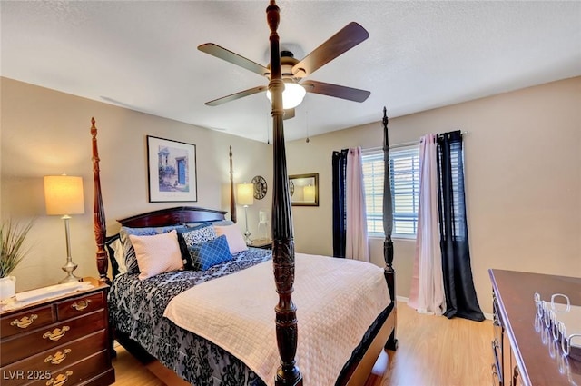 bedroom featuring ceiling fan and light hardwood / wood-style flooring