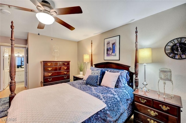 bedroom with ensuite bathroom and ceiling fan