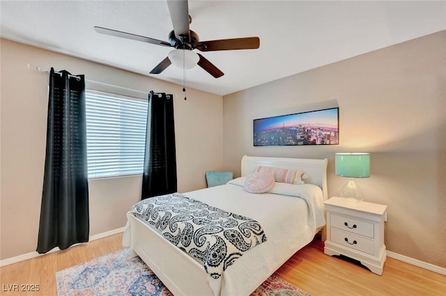 bedroom featuring ceiling fan and light hardwood / wood-style floors