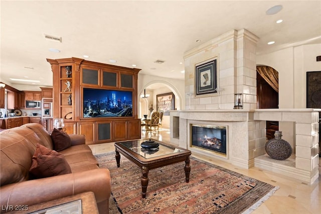 living room with a large fireplace