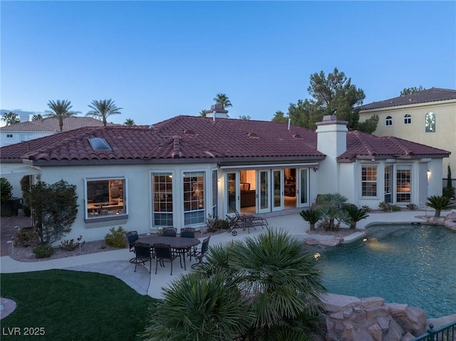 rear view of property featuring a patio