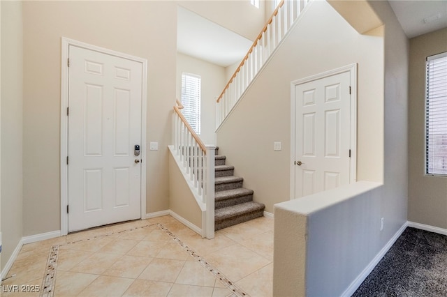 entrance foyer with light tile patterned floors