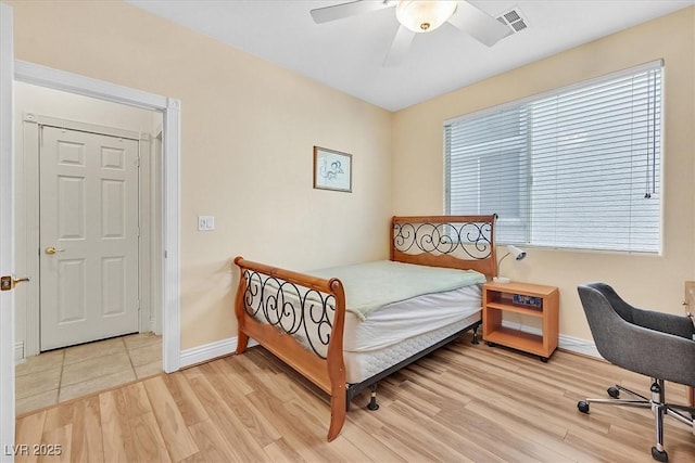 bedroom with ceiling fan and hardwood / wood-style floors