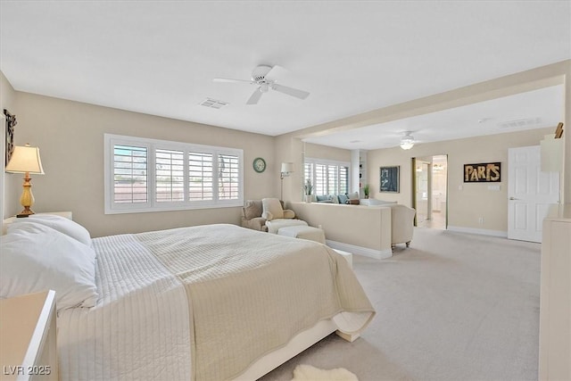 bedroom with ceiling fan and light carpet