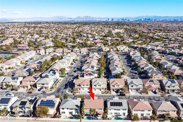 birds eye view of property with a mountain view