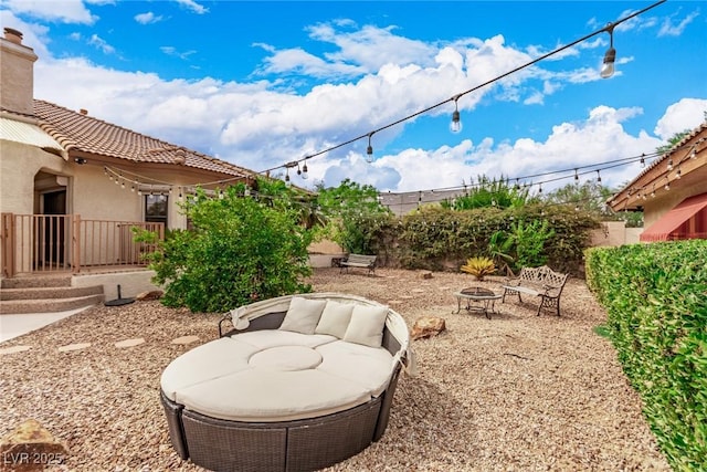 view of yard with an outdoor fire pit, a patio area, and fence