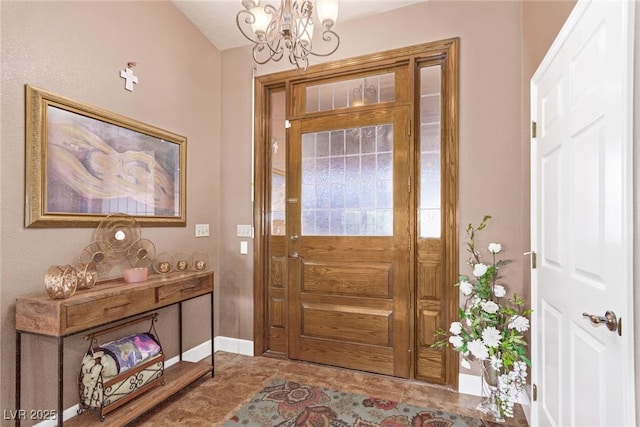 entrance foyer with tile patterned flooring and a chandelier