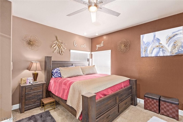 bedroom featuring ceiling fan and light colored carpet