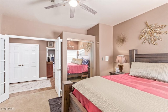 bedroom featuring light carpet and ceiling fan