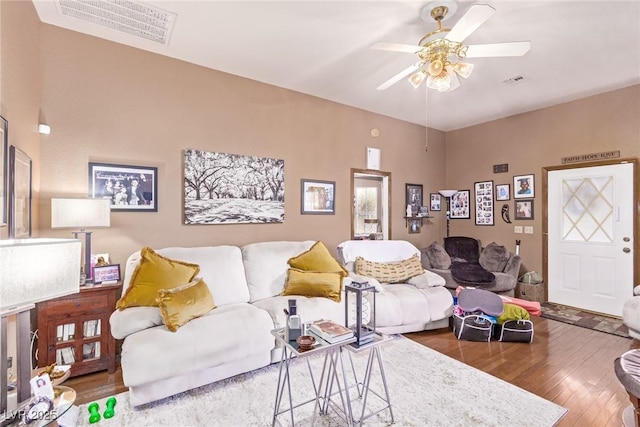 living room with ceiling fan and wood-type flooring