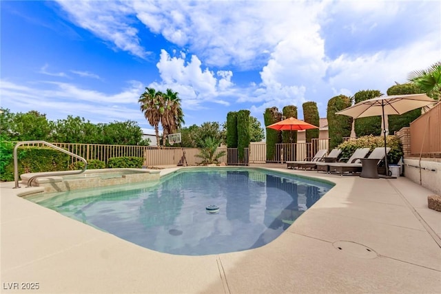 view of swimming pool with an in ground hot tub and a patio