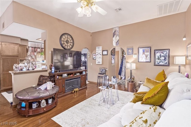 living room with hardwood / wood-style flooring and ceiling fan