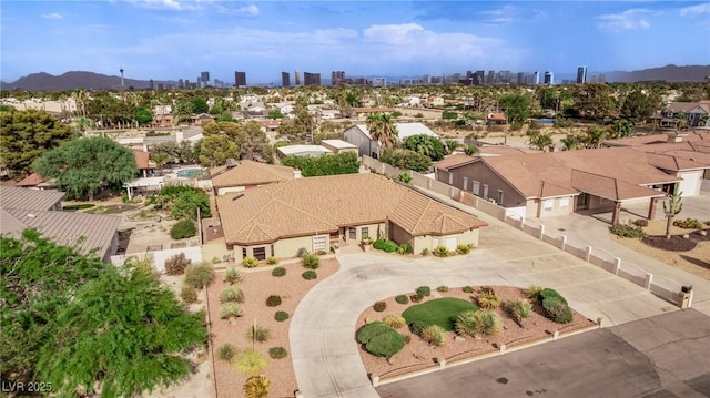 birds eye view of property with a view of city