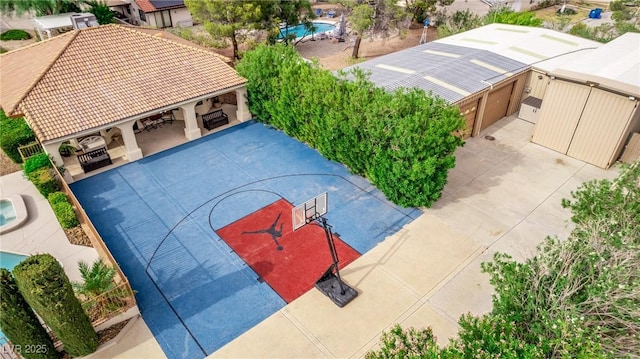 exterior space featuring an outdoor pool, a gazebo, and fence