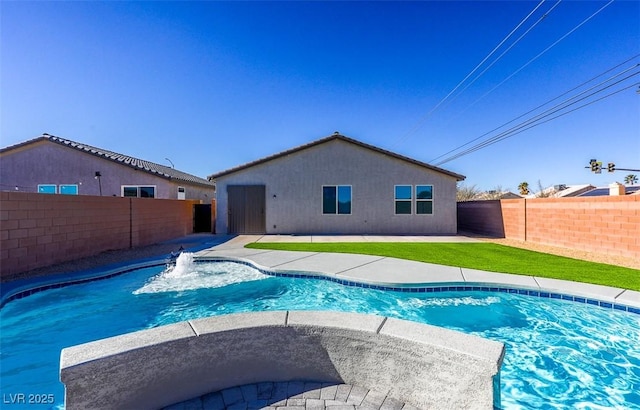 view of pool featuring pool water feature and a patio area