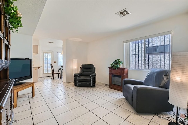 living area featuring light tile patterned floors