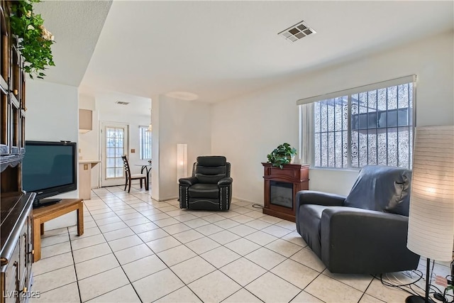 living room with light tile patterned floors