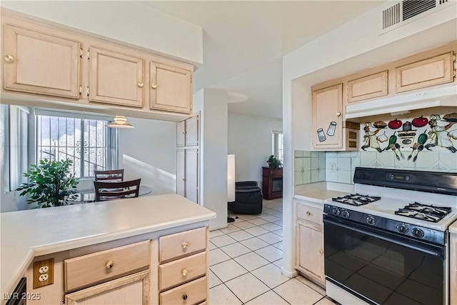 kitchen featuring light brown cabinetry, black dishwasher, backsplash, light tile patterned floors, and white gas range oven