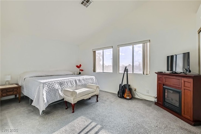 carpeted bedroom featuring vaulted ceiling