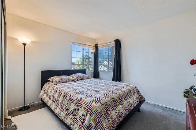 bedroom featuring dark colored carpet