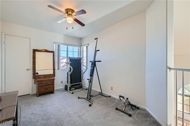 workout room with light colored carpet and ceiling fan