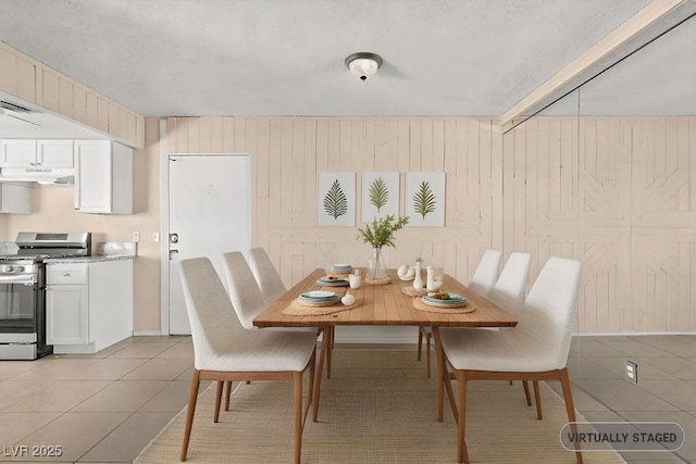 tiled dining area with wooden walls