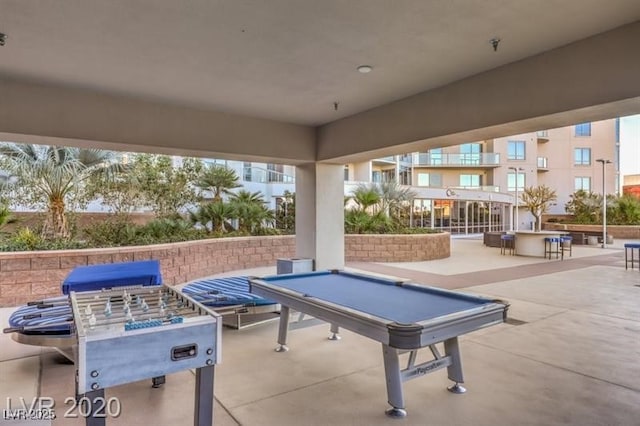 rec room featuring billiards and concrete flooring