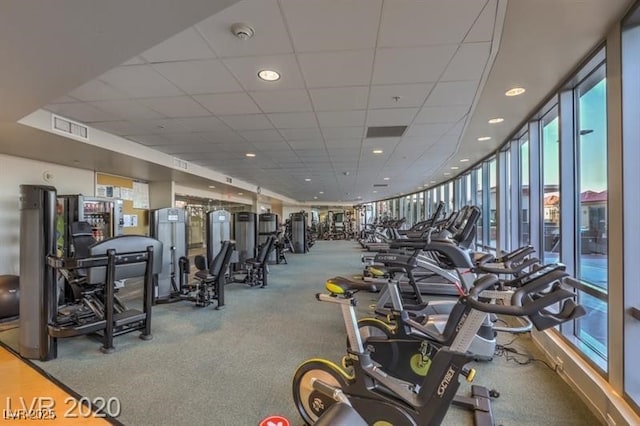 workout area featuring a paneled ceiling