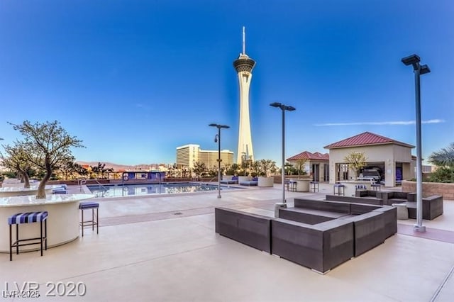 exterior space featuring a community pool and an outdoor bar