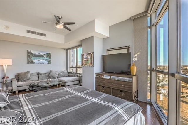 bedroom featuring dark wood-type flooring and ceiling fan