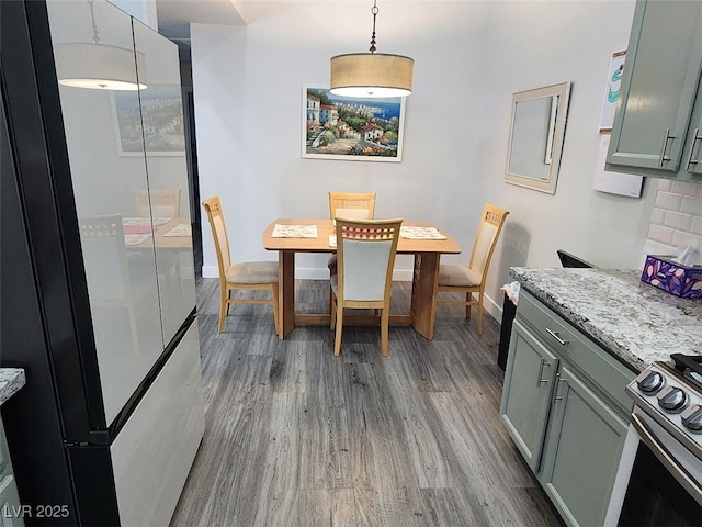 dining space featuring hardwood / wood-style floors