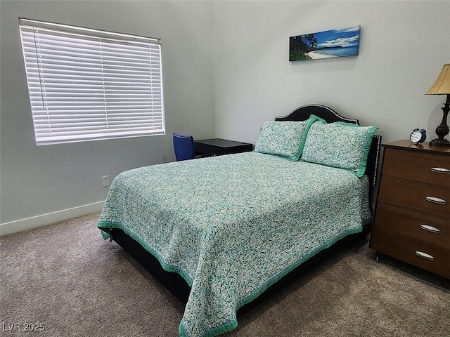 bedroom with dark colored carpet