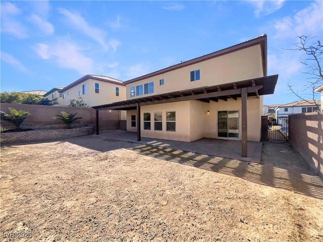 rear view of house with a patio area