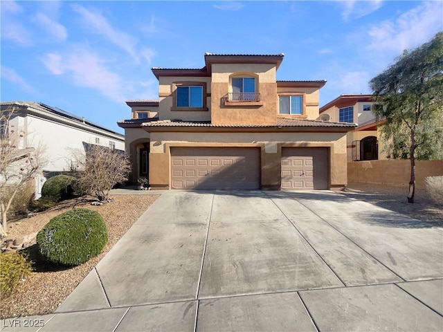 mediterranean / spanish-style home with a garage