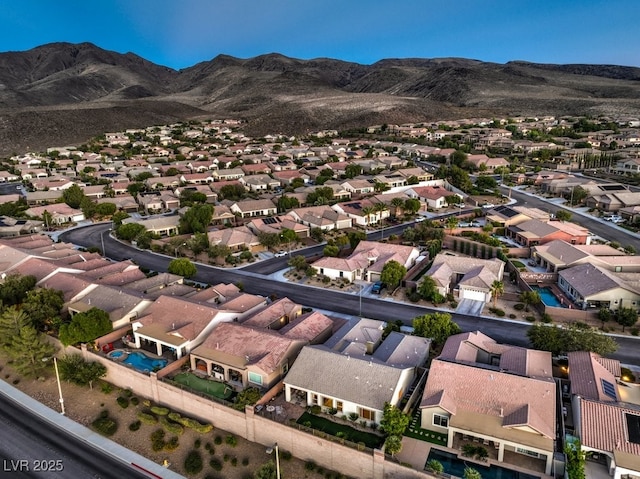 birds eye view of property with a mountain view