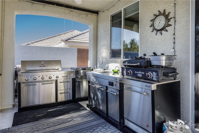 view of patio featuring sink, area for grilling, and grilling area