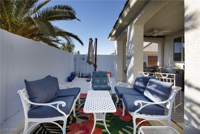 view of patio / terrace featuring area for grilling and ceiling fan