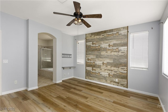 206 Pebble Creek Hts, Mesquite, NV 89027 - empty room with arched walkways, baseboards, and wood finished floors
