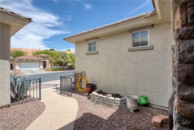 206 Pebble Creek Hts, Mesquite, NV 89027 - view of home's exterior with stucco siding and fence