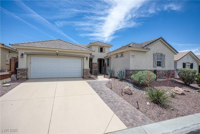 206 Pebble Creek Hts, Mesquite, NV 89027 - view of front of home featuring stone siding, concrete driveway, an attached garage, and stucco siding