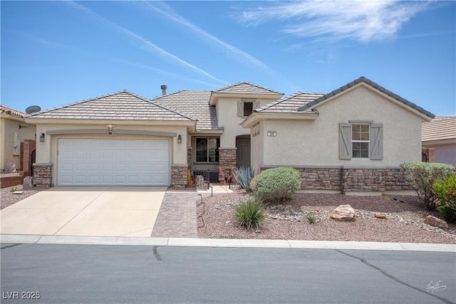 206 Pebble Creek Hts, Mesquite, NV 89027 - view of front facade featuring stone siding, stucco siding, concrete driveway, and an attached garage
